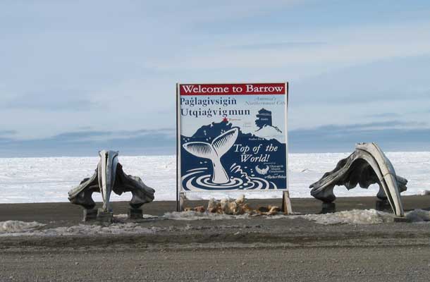 Sign with Whale Tale image that says welcome to Barrow