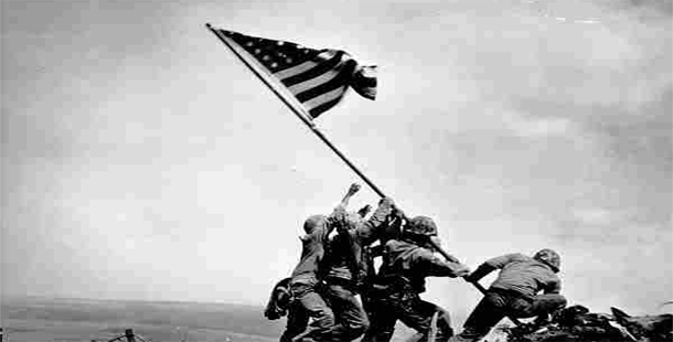 A group of soldiers raising a flag