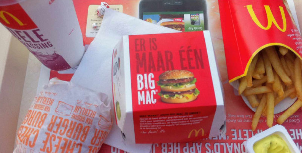 A fries on a red box with a picture of a hamburger