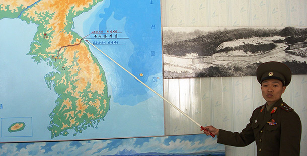 Korean man pointing to map