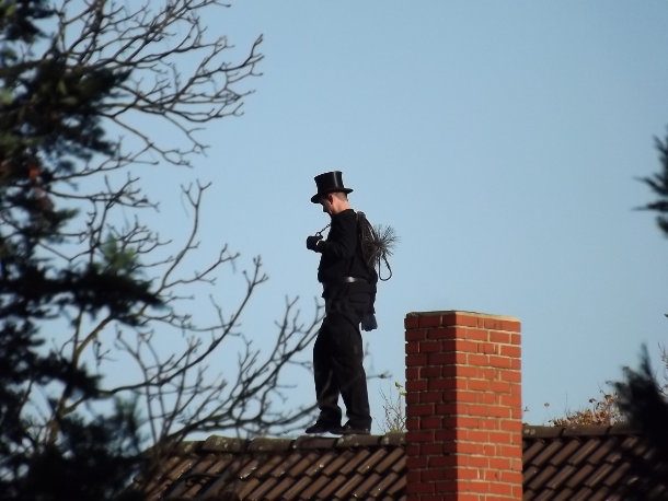 chimney sweep on the roof