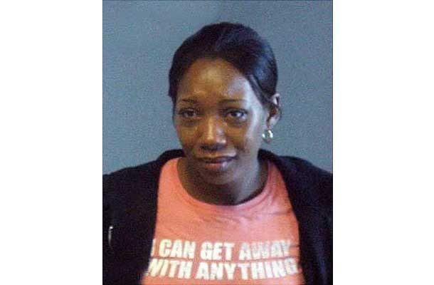 Woman in shirt that says I can get away with anything