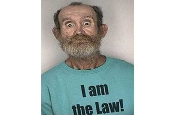Man with shirt that says I am the law!