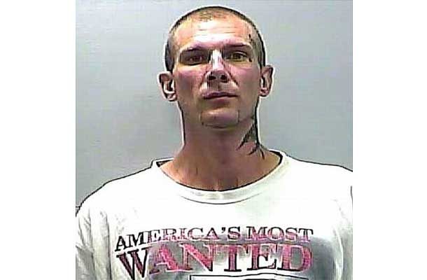 Man with shirt that says America's most wanted