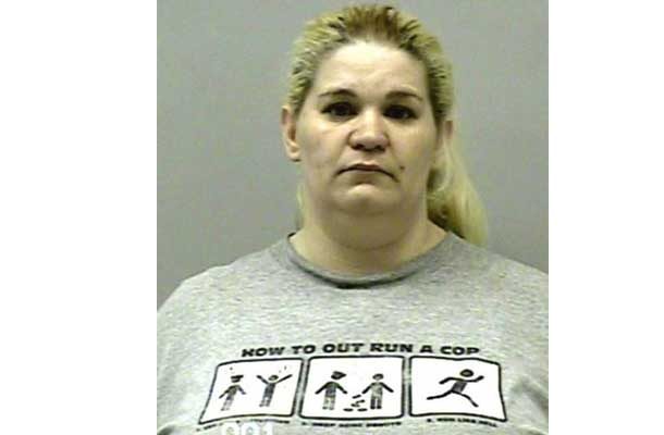 Woman with shirt that says How to outrun a cop