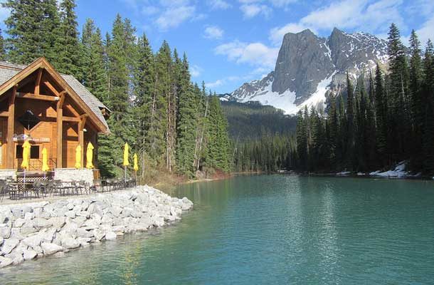emerald lake with cabin to the left