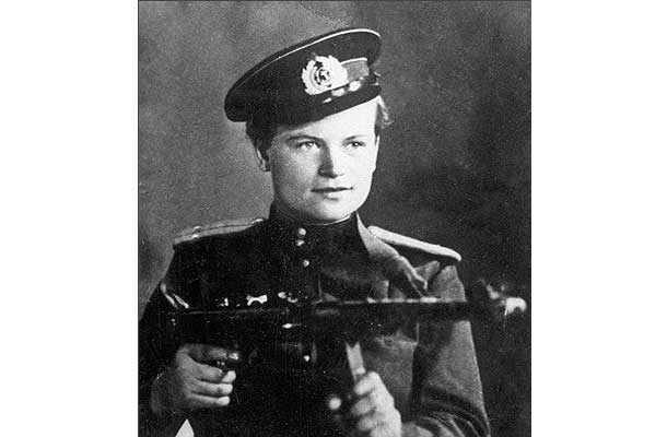 Yevdokiya holding a machine gun