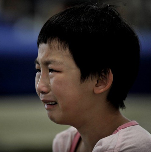 Young gymnast crying