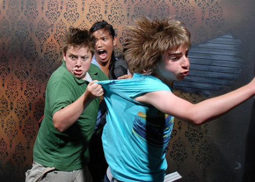 people scared in a haunted house
