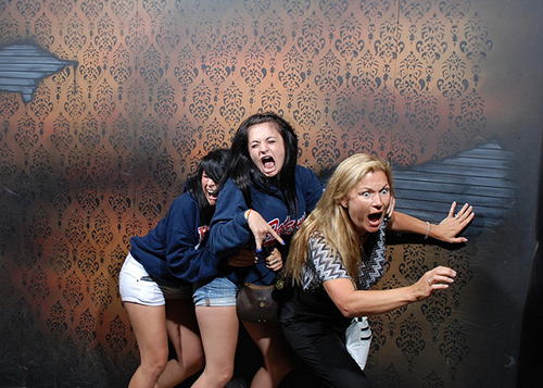 people getting scared in a haunted house