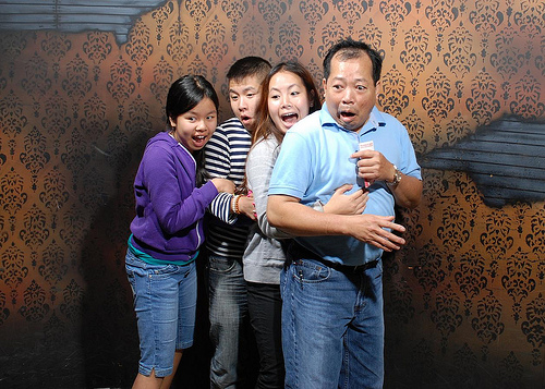people getting scared in a haunted house