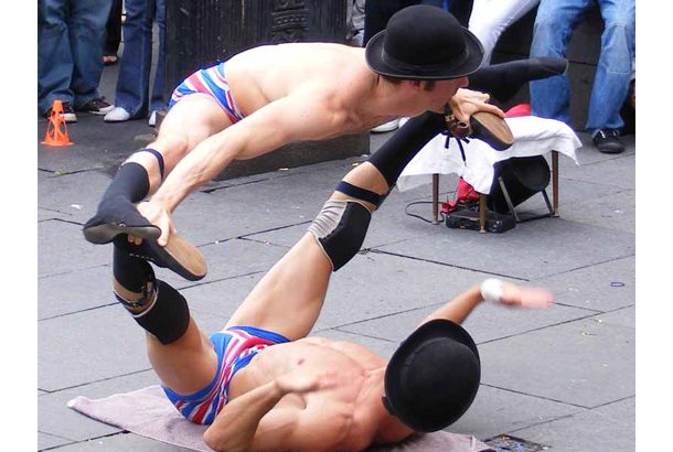 two men in union jack shorts splitting on top of each other