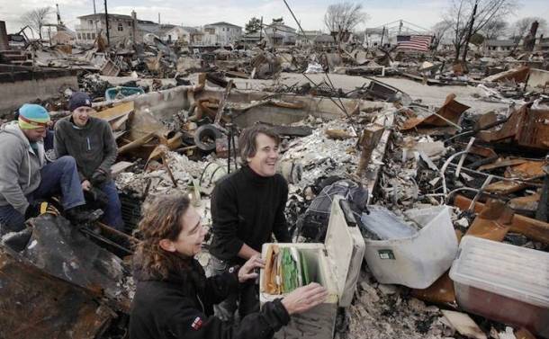 A couple smiles after finding records despite of the Frankenstorm attack