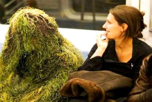 man in gilly suit made to look like grass