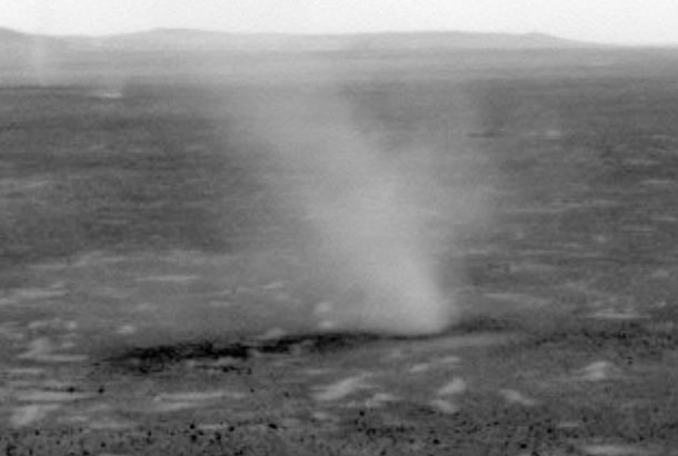 black and white photo of dust devil