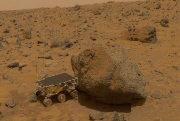 rover next to large boulder