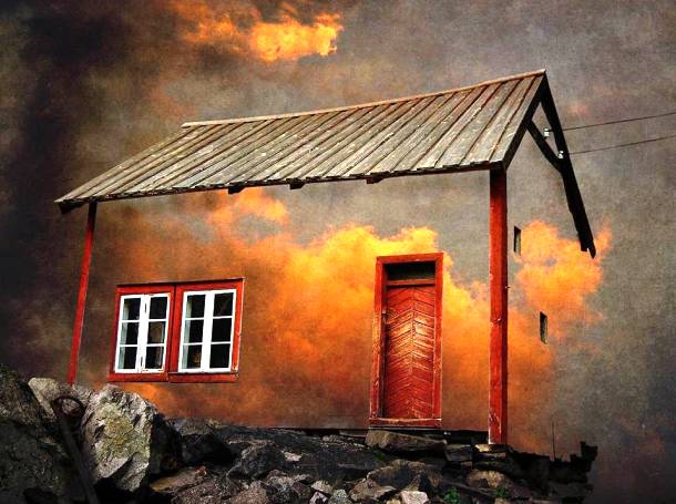 A Whimsical House Set in the Burning Clouds of a Fiery Sunset