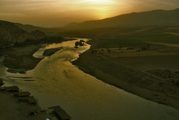 Shatt al-Arab at sunset with mountains in the distance