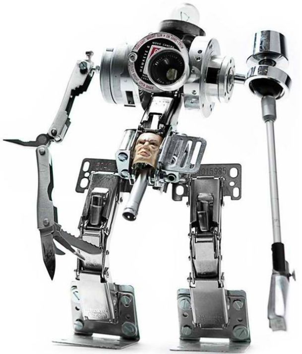 Robot Sculpture using scrapped hardware, camera, VCR, pliers, lamp parts, and toys