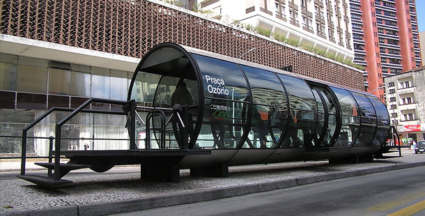 A bus stop concepts black tunnel with a glass door