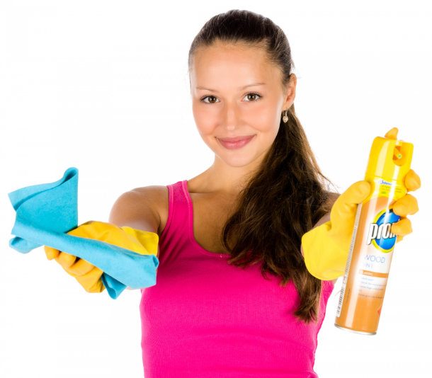 woman holding out cleaning supplies