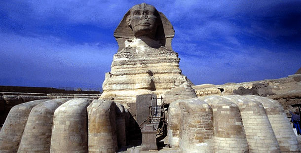 A large egyptian stone statue of a sphinx