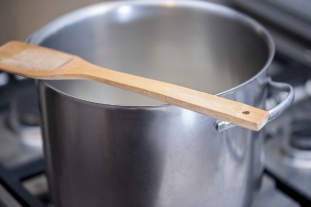 wooden spoon over pot