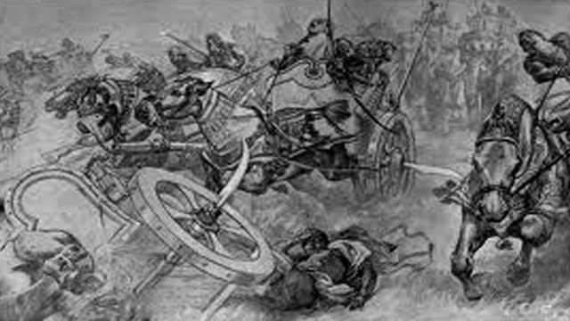 http://en.wikipedia.org/wiki/File:The_charge_of_the_Persian_scythed_chariots_at_the_battle_of_Gaugamela_by_Andre_Castaigne_(1898-1899).jpg