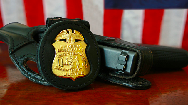 http://en.wikipedia.org/wiki/File:FBI_Badge_%26_gun.jpg