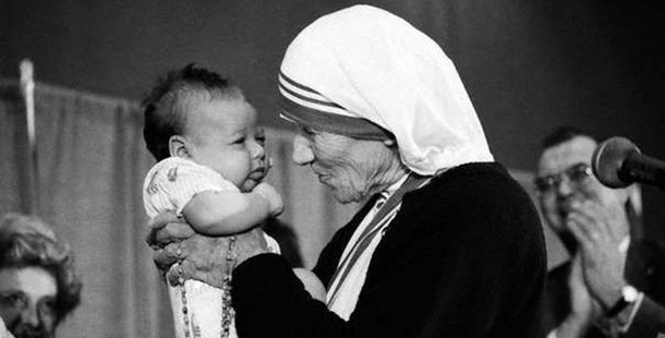 A nun holding a baby