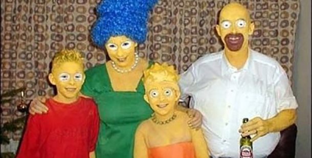 A family dressed up in awful simpson's costumes