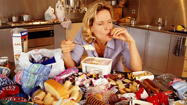 women eating a lot of food emotional eating