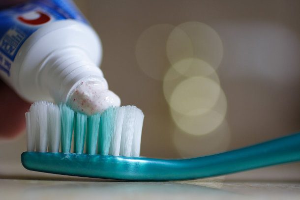 drop of toothpaste on toothbrush