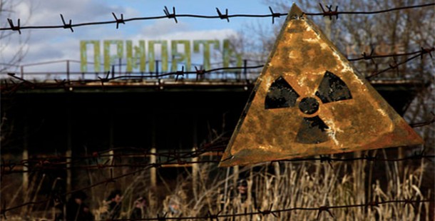 A fact sign about chernobyl accident on a barbed wire fence
