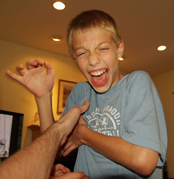 Human being tickled