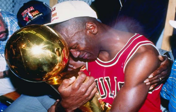 Series MVP and guard Michael Jordan of the Chicago Bulls hugs the championship trophy as the Bulls defeated the Los Angeles Lakers 1991