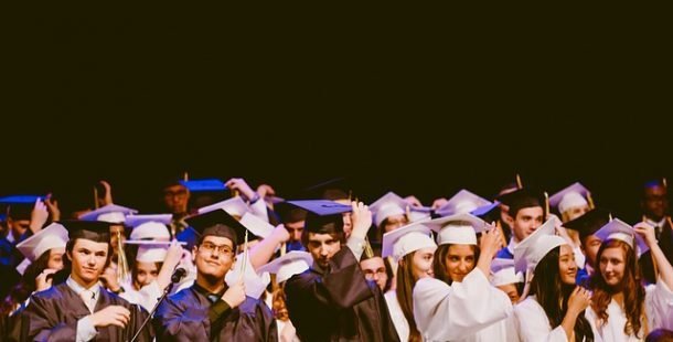 A group of people in graduation gowns and caps
