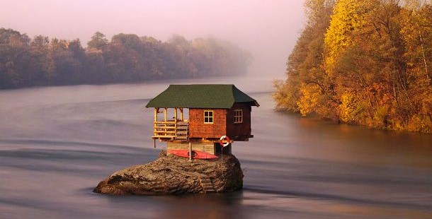 A house on a rock in water
