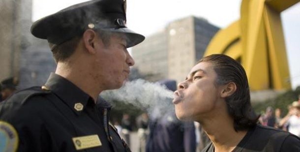 A police officer blowing out smoke from a person, facts abut cannabis