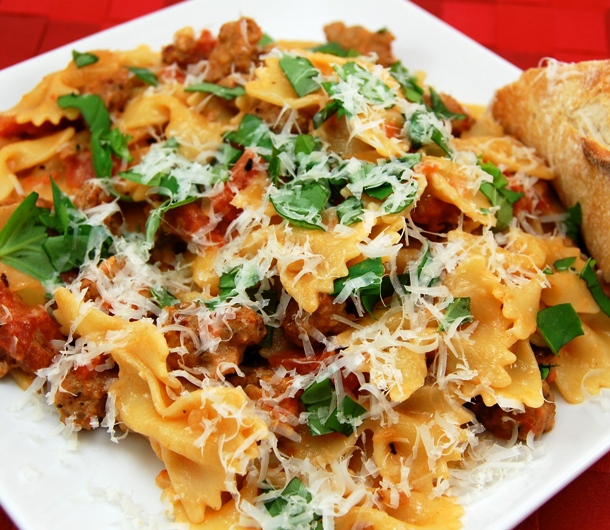 sweetpeaskitchen.com farfalle-pasta-with-sausage-tomatoes-and-cream