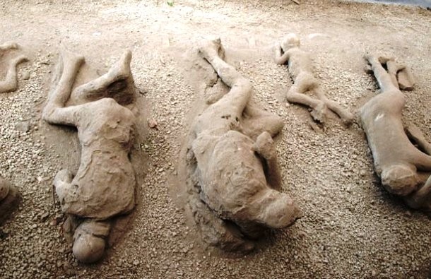 a group of huperson figures made of sand