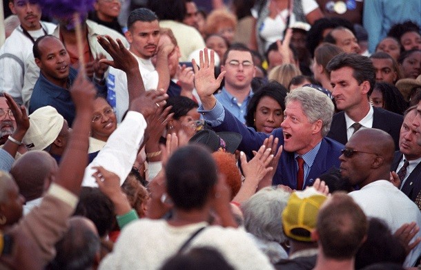 Bill Clinton in middle of big group