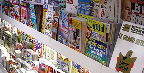 A close-up of a shelf with magazines