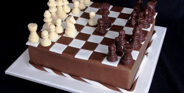 A cake with chess pieces on it
