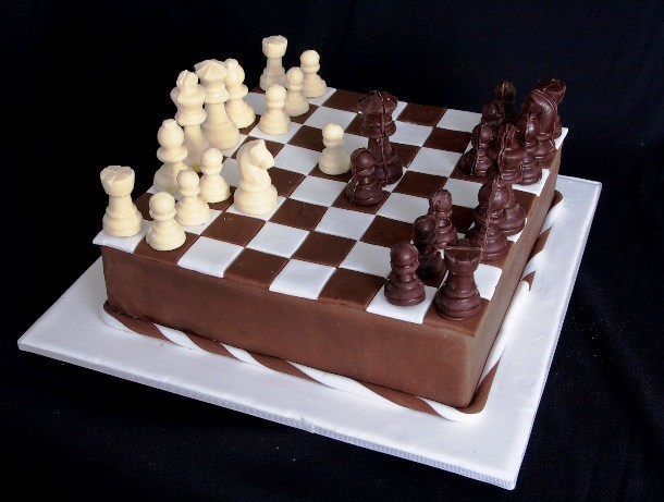 a cake with chess pieces on it