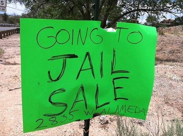 going to jail garage sale sign
