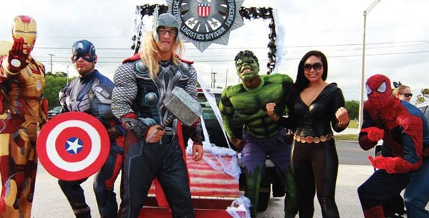 A group of people wearing superheroes clothing