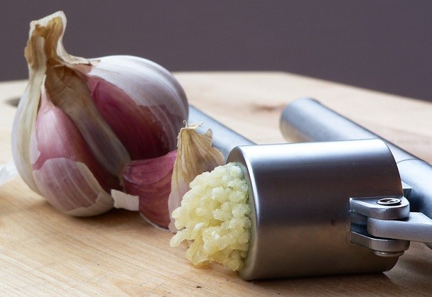 garlic press and garlic