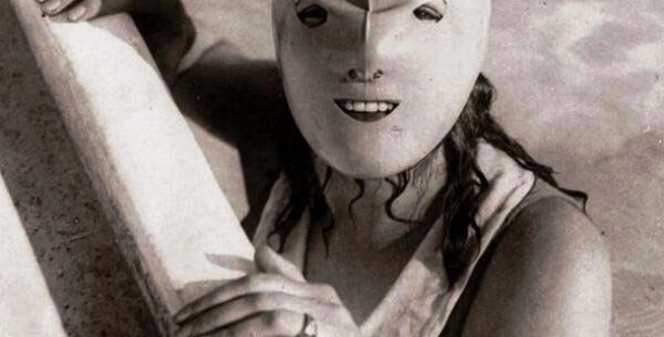 A historical photos of a person wearing a mask
