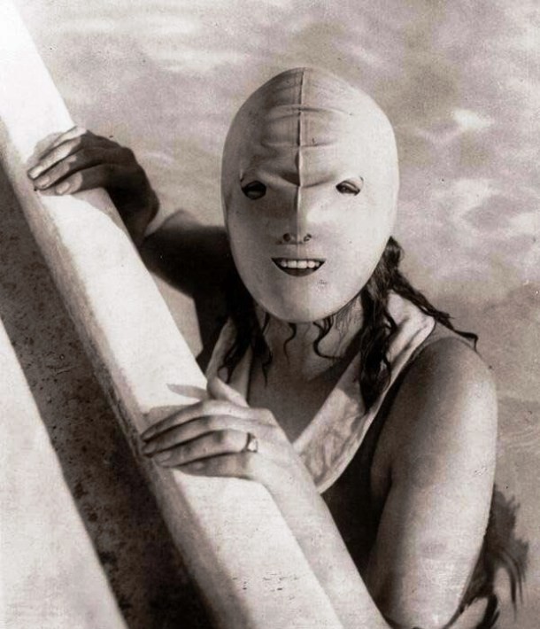 a historical photos of a person wearing a mask